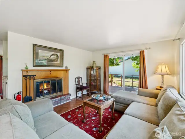 Cozy living area with real fireplace.  Slider to another deck.