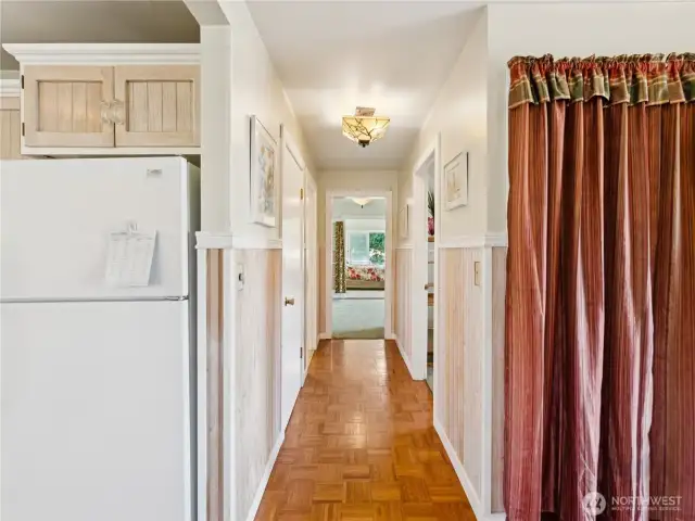 Parquet hallway leading to the rest of the house.