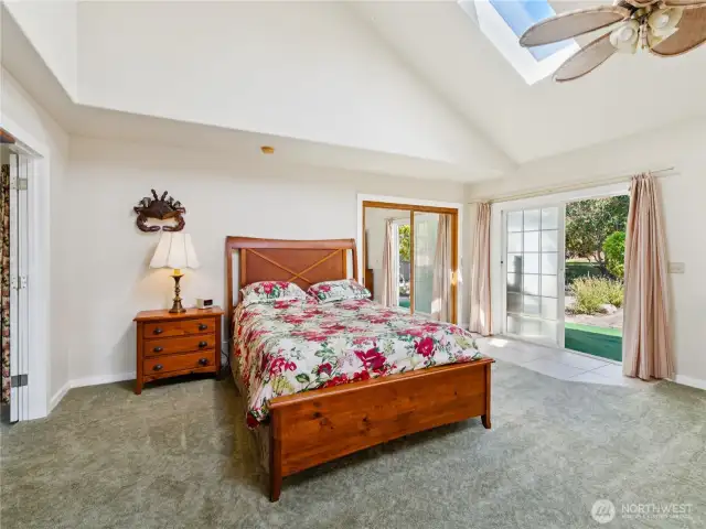 Primary bedroom has a slider leading to back fire pit and guest studio.