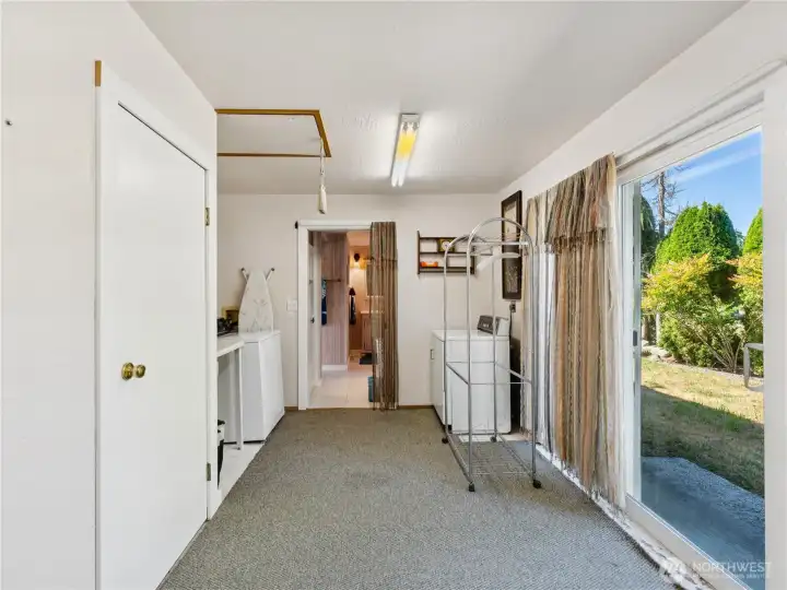 Utility room outdoor entrance from side yeard. Utility room also connects to primary bath & primary suite. This room could be converted to so many things!