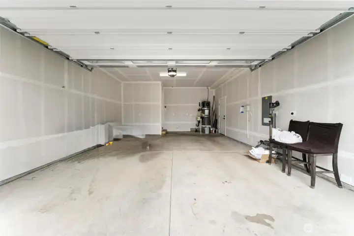 Two car garage with small shop space + garage door opener