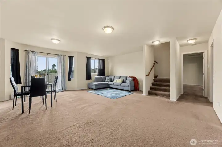 Dining room and main living room in open area.