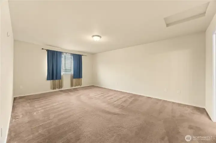Primary bedroom on main floor. Huge! Check out the floor plan images.