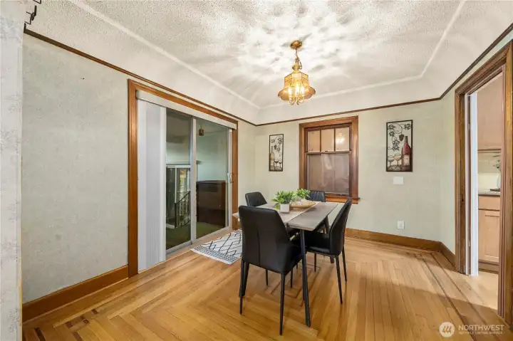 Coved ceilings throughout create the perfect ambiance in the dining room, off the sliding glass door leads out to the 3 finished sunrooms.