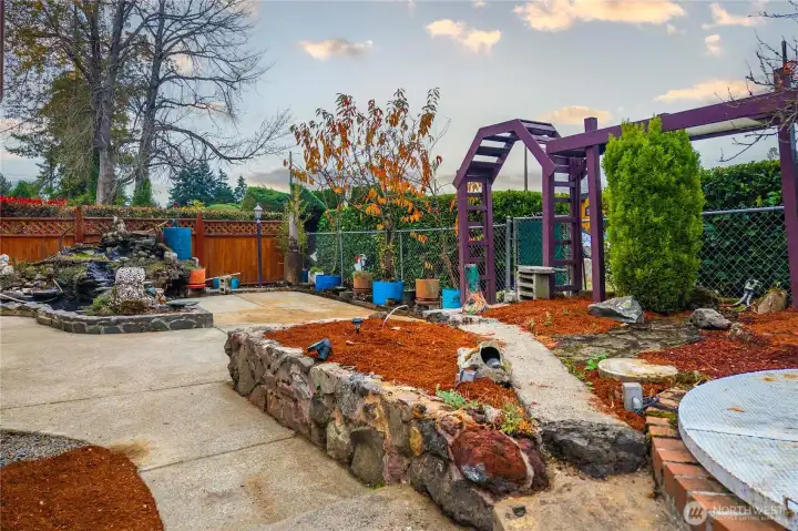 2nd water feature pond, arched gated side access off side driveway