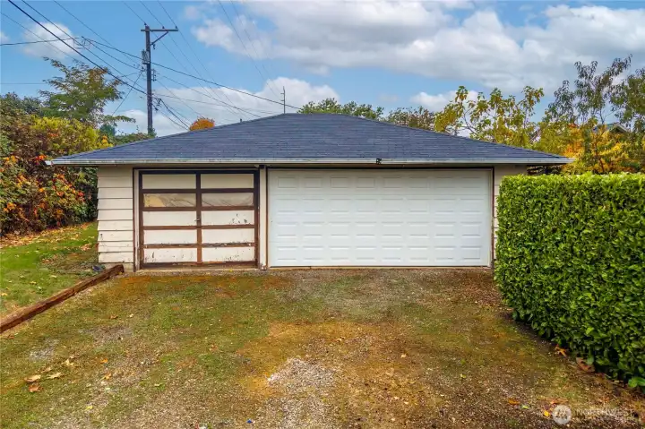 Detached 3 car garage (newer roof) behind house, private driveway access off side of house