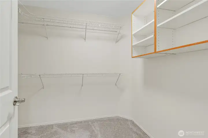 The walk-in closet off the primary suite the other closet is directly across from this one