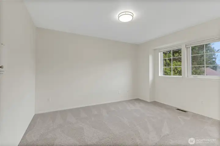 This is the 3rd good size bedroom upstairs that looks over the front of the house. Both bedrooms have laundry shoots built in to the utility room below!