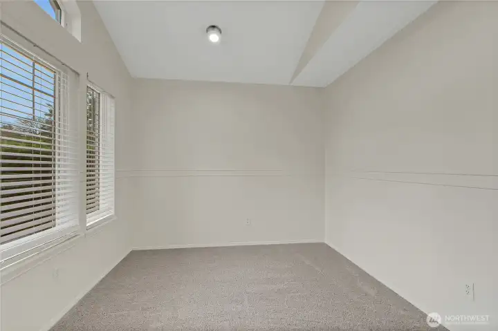 This is the bonus room upstairs or 4th room that includes a closet. It has large pretty windows and tall ceilings for natural light and would make a great extra bedroom or art/craft studio!