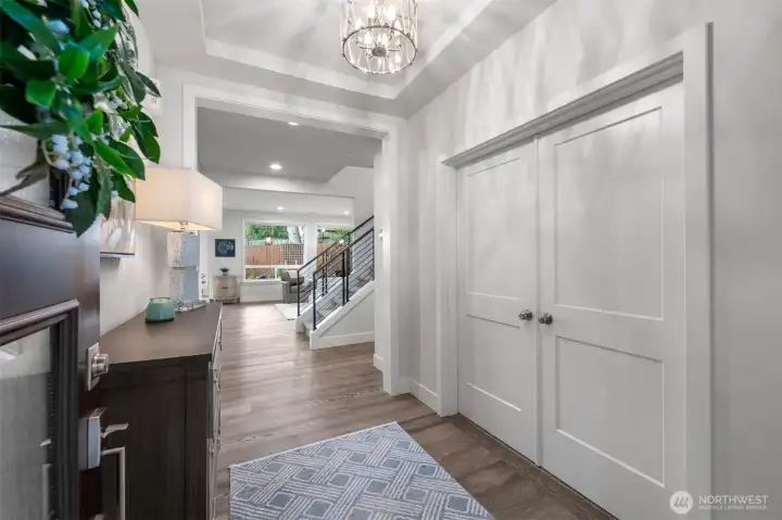 Exquisite entry features tall ceilings and beautiful hardwood floors.