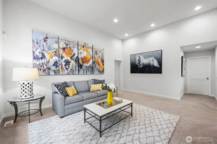 Additional flex space located on the upper floor with soaring ceilings.