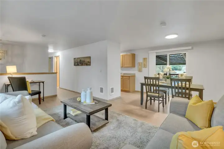 Great room open to multi-level decking with lake views