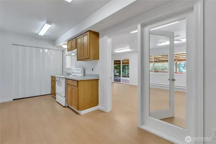 2nd kitchen & dining room open to 2nd family room w/access to full and lake views.