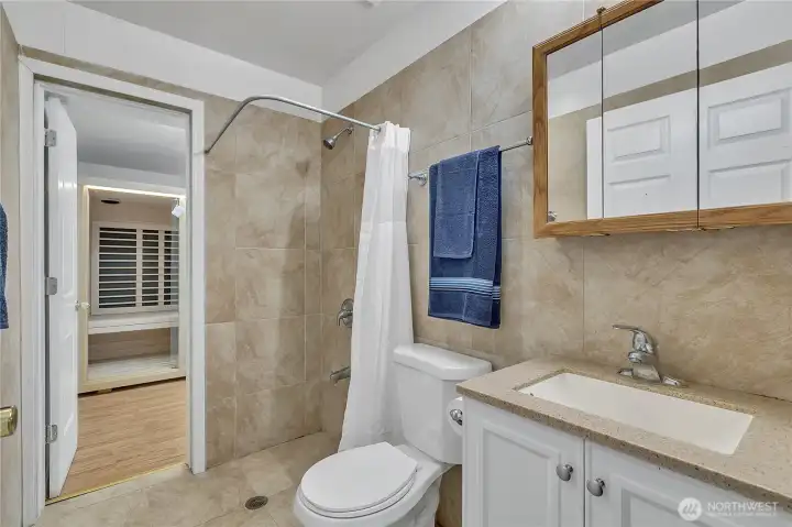 Updated bathroom downstairs with full height tile & walk in shower.