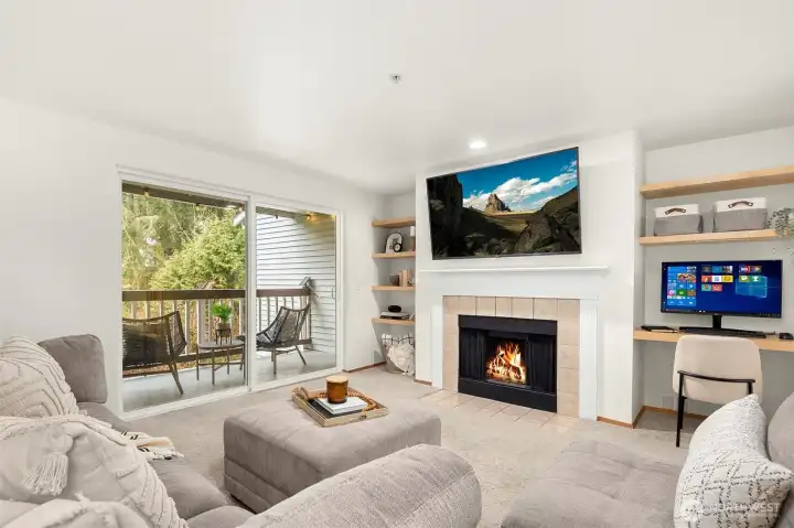 Welcome in to the light loving spacious living room featuring new windows and slider