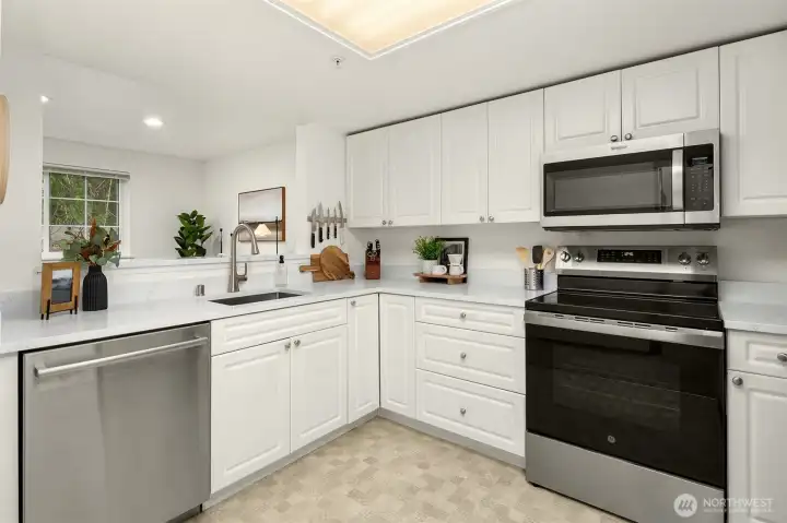 Kitchen overlooks the formal dining area.