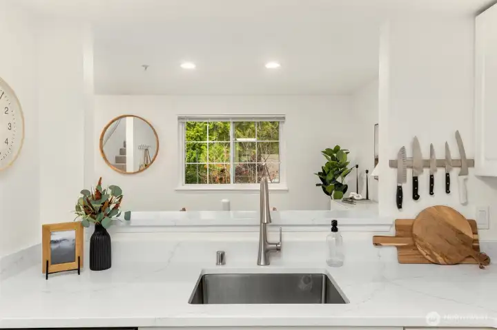 High top countertop off the kitchen into the dining area.