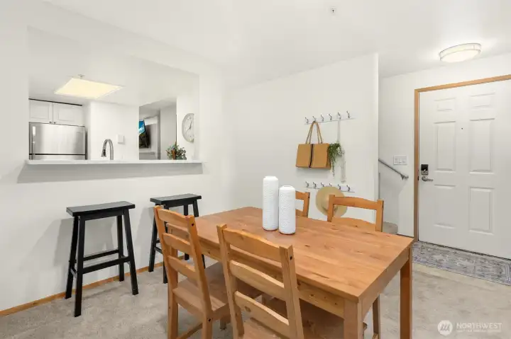 Enter in to the bright formal dining area, with stairs leading to the upper bedrooms.