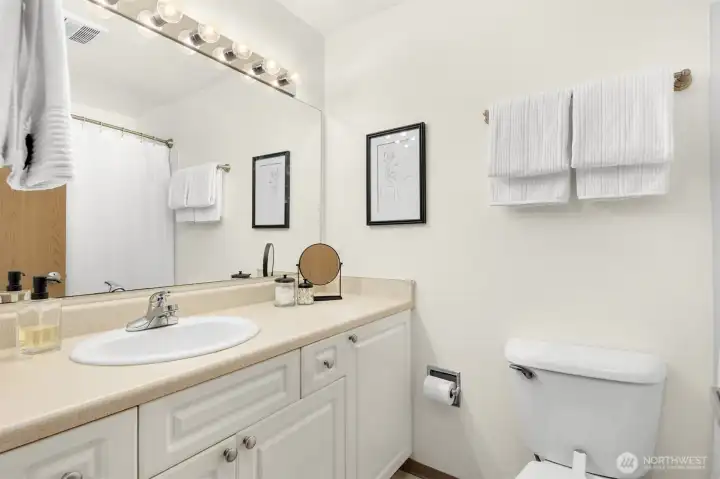 Primary bathroom with plenty of counter space + massive mirror. (21 & 24 need to be switched)