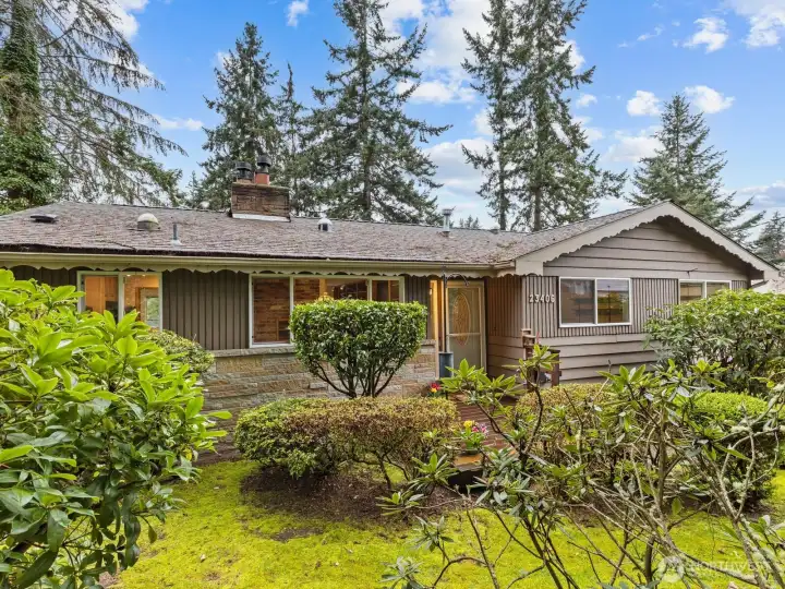 Sited on a gorgeous, sun-filled corner lot, this home is a gardener's dream!