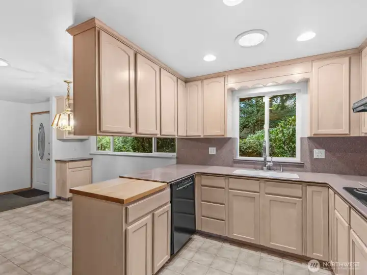 There's plenty of space on the Corian counters for all of your cooking and baking needs and you even have a built in cutting board!