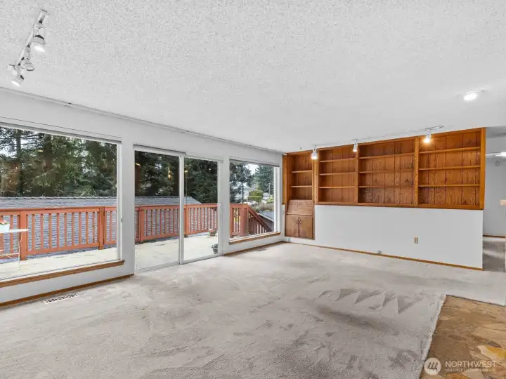 Just on the other side of the wall is the generously sized living room with access to the back deck.
