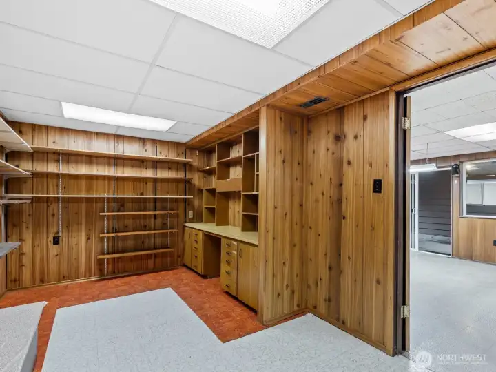 Nearby, a private home office has a built-in desk and shelving.