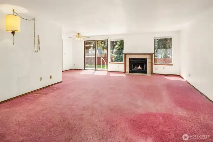 Living Room with Slider to Fenced Backyard & Patio