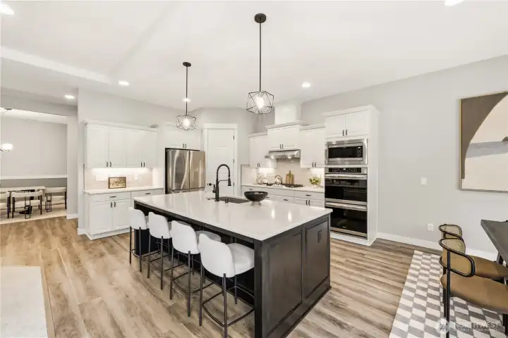 Kitchen has double ovens and a walk-in pantry