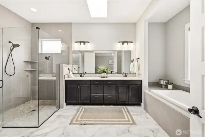 Spacious en suite has double vanities...