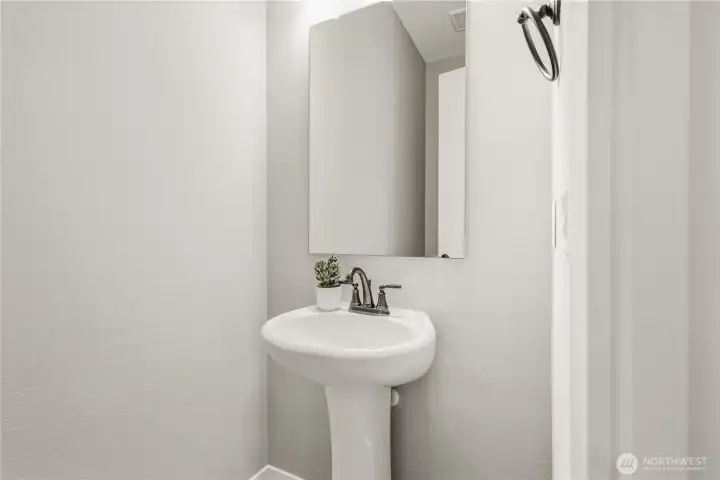 Main level also features an additional half bathroom