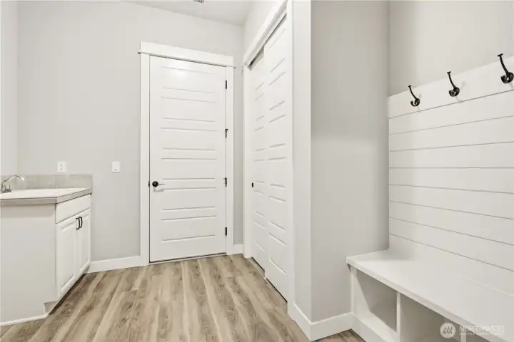 Large laundry room with storage leads to your oversized 3-car garage