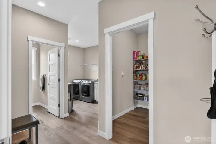 Powder room, laundry room and pantry off of the garage entry