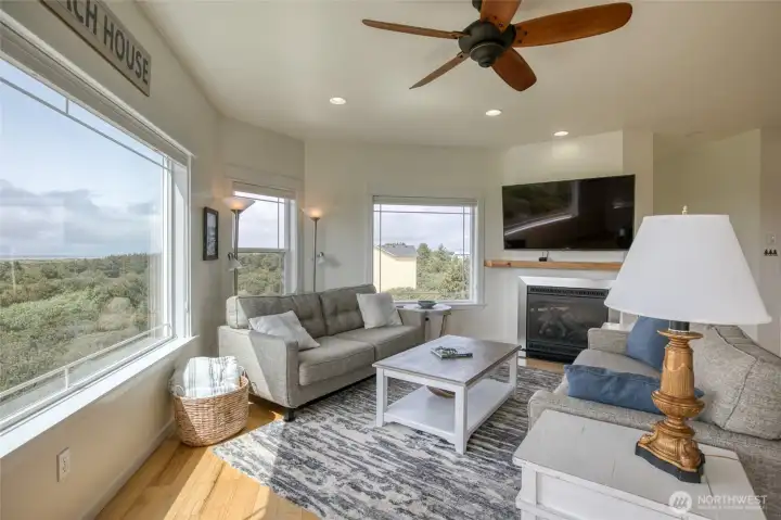 Cozy propane fireplace and coastal style ceiling fan Cozy propane fireplace and coastal style ceiling fan
