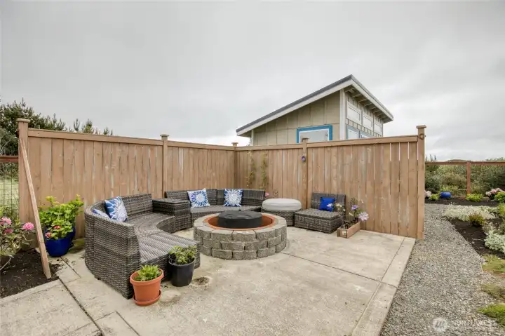 Patio with fire pit and wind screen Patio with fire pit and wind screen
