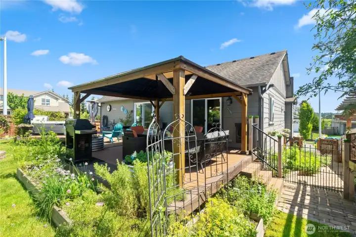 Large, custom deck with garden space around it