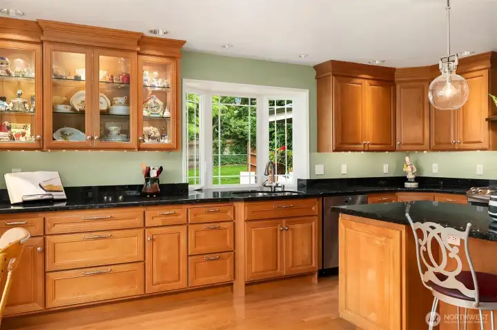 A culinary enthusiast delight featuring glass cabinetry seamlessly blending everyday luxury with refined elegance. A culinary enthusiast delight featuring glass cabinetry seamlessly blending everyday luxury with refined elegance.
