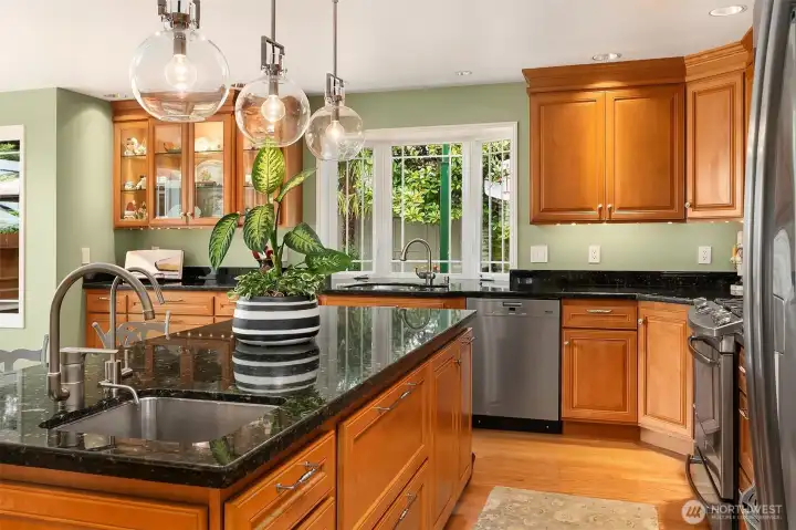 The Chef's kitchen features dual task zones with separate sinks and a concealed oversized walk-in pantry. The Chef's kitchen features dual task zones with separate sinks and a concealed oversized walk-in pantry.