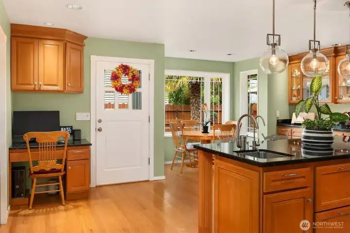 This grand kitchen balances scale and function featuring statement island eating bar, a charming breakfast nook and a streamline workstation. This grand kitchen balances scale and function featuring statement island eating bar, a charming breakfast nook and a streamline workstation.