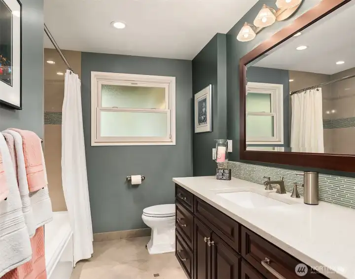 Tastefully modernized full bath with heated flooring. Tastefully modernized full bath with heated flooring.
