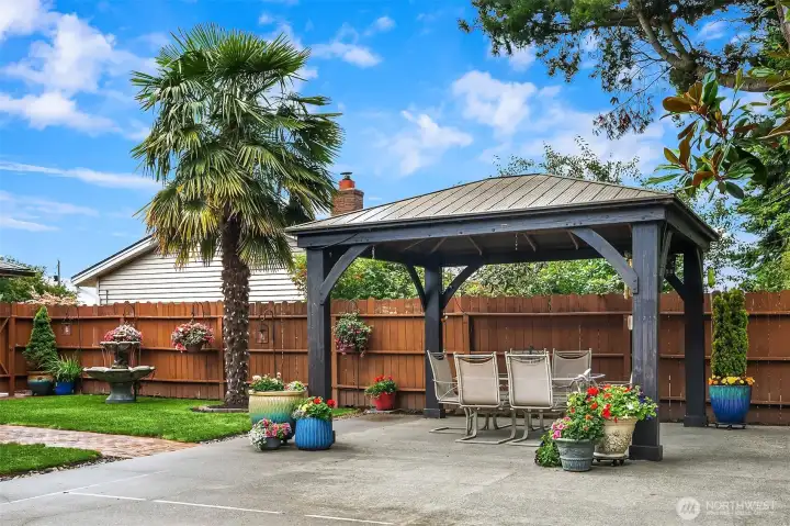 Floral bouquet surrounds the yard on your way to the second gated garage. Floral bouquet surrounds the yard on your way to the second gated garage.
