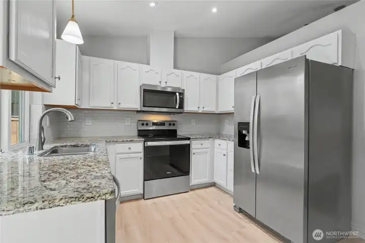 Kitchen view one, love the contrast of the countertops to the cabinets and the matching stainless steel appliances. Kitchen view one, love the contrast of the countertops to the cabinets and the matching stainless steel appliances.