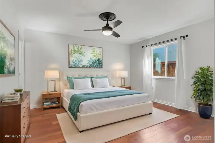 Primary ensuite bedroom view, nice flooring and updated ceiling fan/light fixture. Good size as well! Ensuite bath door to your left. ***Virtually Staged*** Primary ensuite bedroom view, nice flooring and updated ceiling fan/light fixture. Good size as well! Ensuite bath door to your left. ***Virtually Staged***
