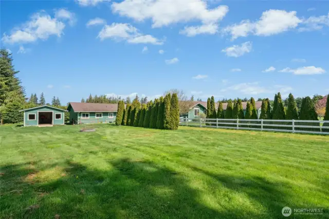 side field with 2 shops in distance