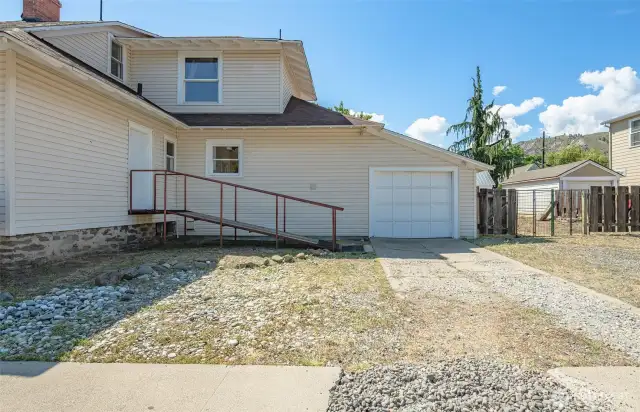 Garage entry, parking and door to main floor bedroom.