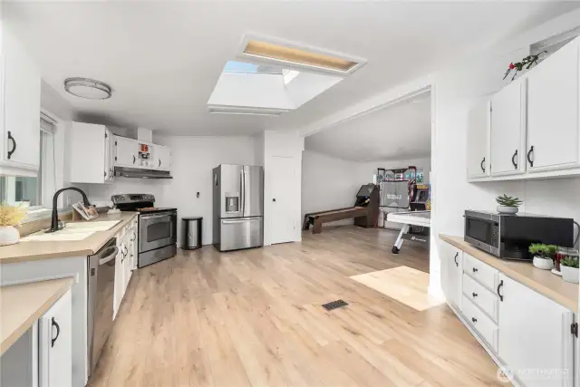 Kitchen opens up the family room and dining room