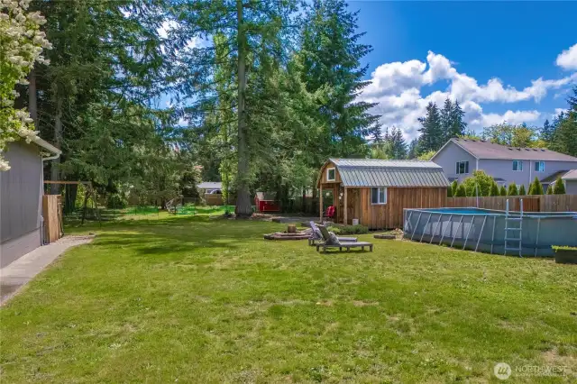 Beyond the shed is a chicken and rabbit coop, and a firepit