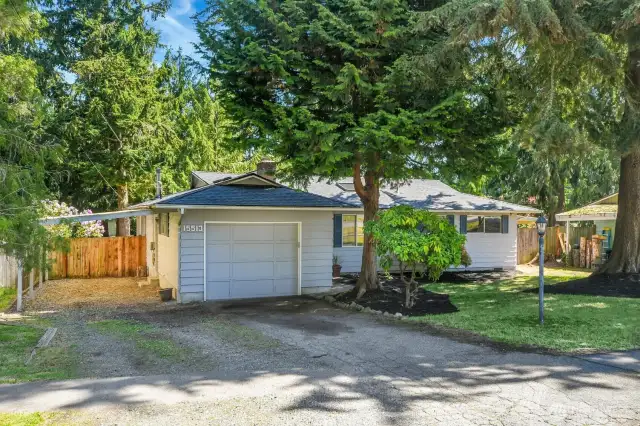 One-car garage with 40-amp EV outlet plus a large tandem carport—great for extra parking or a boat.