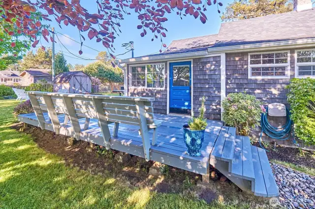 A shady retreat on the deck is the perfect spot to unwind with the sound of the surf nearby