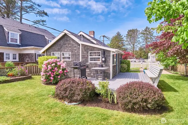 Beautiful mature landscaping creates a serene, park-like setting that enhances curb appeal and offers privacy and tranquility year-round.